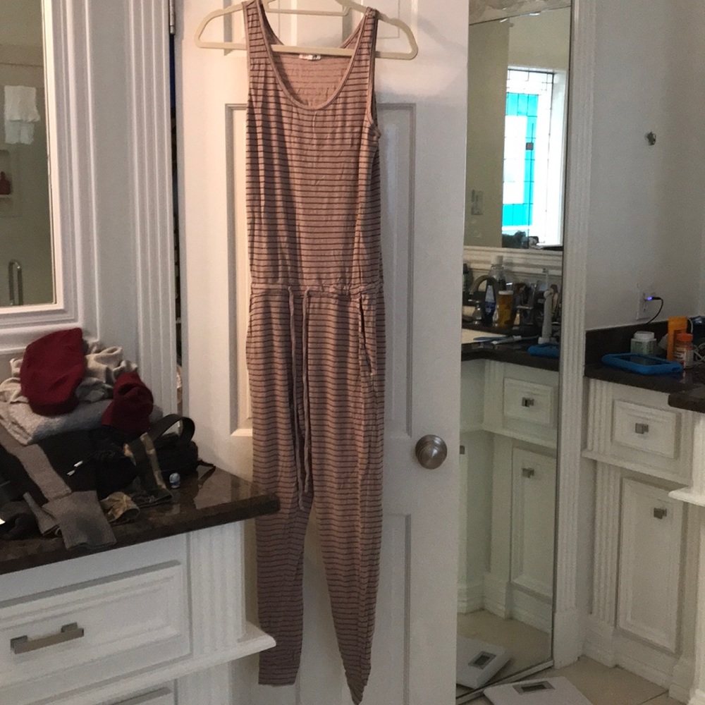 Sleeveless romper. Tan and black striped.